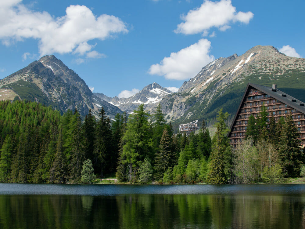 The natural Štrbské Pleso in the shadow of the mountains.